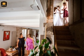 At Saint Clar Bed and Breakfast, a beautiful bride is getting ready upstairs while her bridesmaids prepare on the lower level in a charming scene filled with excitement and anticipation.